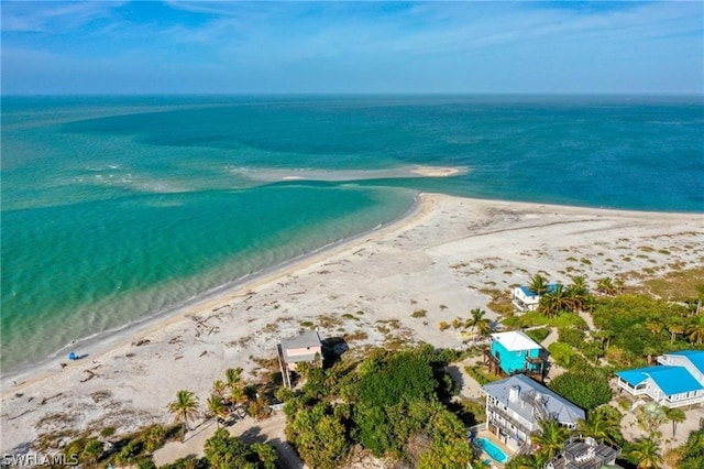 bird's eye view with a water view and a view of the beach