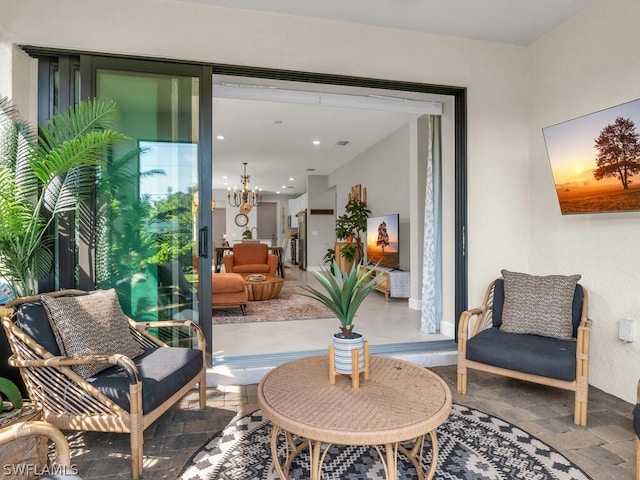 interior space featuring a notable chandelier and tile floors