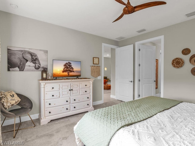 bedroom featuring light carpet and ceiling fan