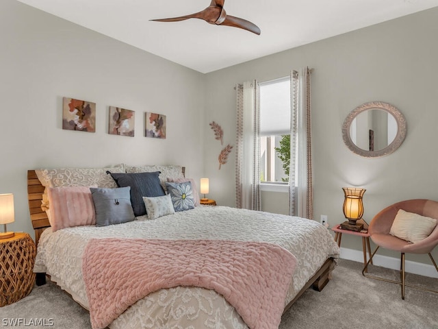 carpeted bedroom featuring ceiling fan