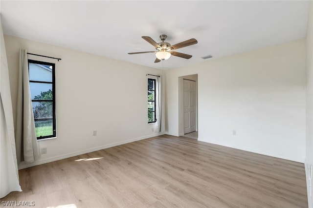 unfurnished room featuring light hardwood / wood-style flooring and ceiling fan