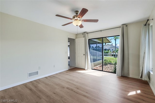 spare room featuring ceiling fan and light hardwood / wood-style flooring