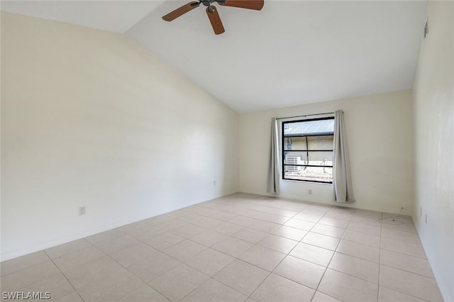 tiled empty room featuring ceiling fan and lofted ceiling