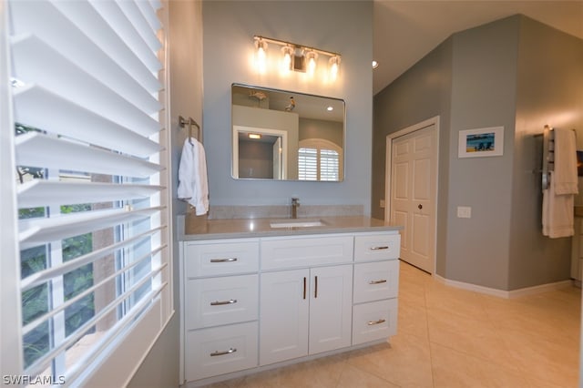 bathroom with vanity and tile patterned flooring