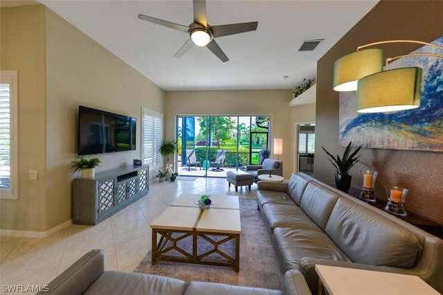 tiled living room with ceiling fan