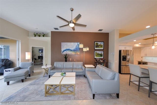 tiled living room featuring ceiling fan