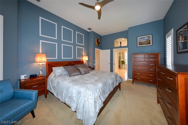 bedroom with light carpet and ceiling fan