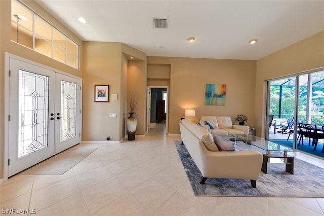 tiled living room featuring french doors