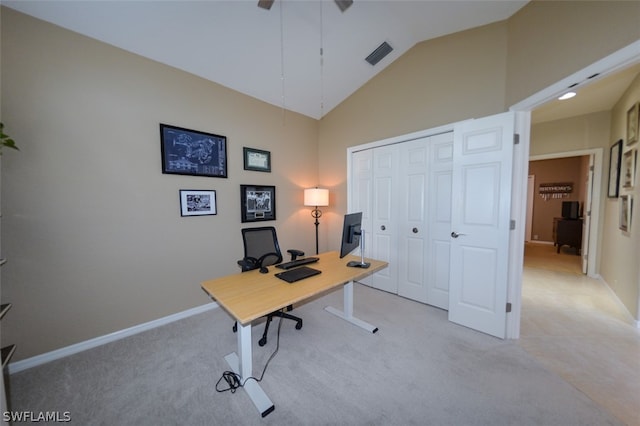 carpeted office space with high vaulted ceiling