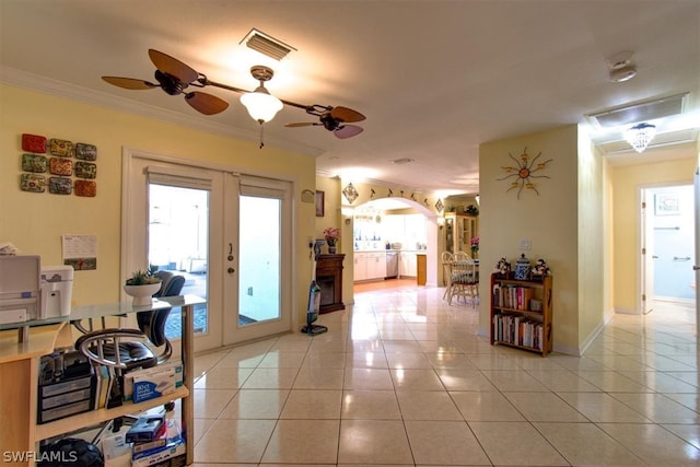 home office featuring french doors, ceiling fan, tile floors, and ornamental molding