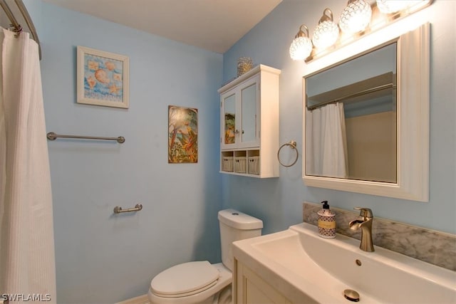 bathroom with toilet and vanity