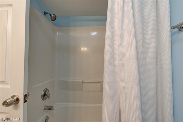 bathroom featuring shower / bath combination with curtain