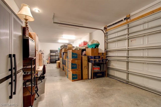 garage with stainless steel refrigerator