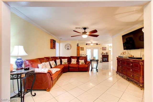 living room featuring french doors, ornamental molding, ceiling fan, and light tile flooring