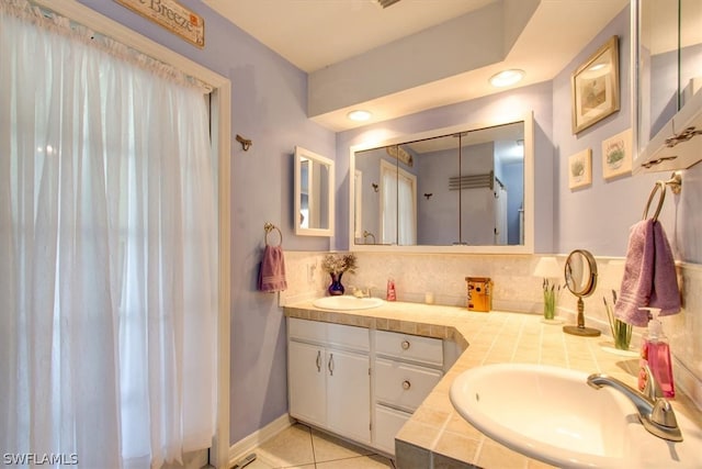 bathroom featuring tile flooring and vanity