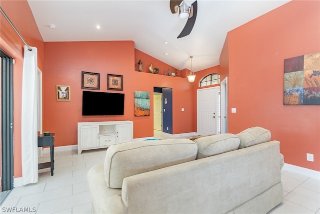 tiled living room with high vaulted ceiling and ceiling fan