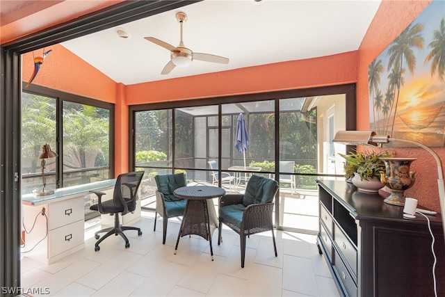 interior space with lofted ceiling and ceiling fan