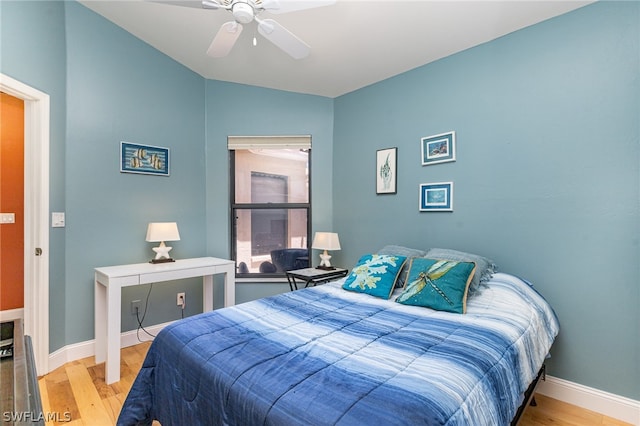 bedroom with ceiling fan and hardwood / wood-style flooring