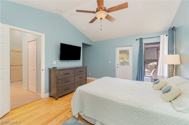 bedroom featuring ceiling fan, vaulted ceiling, and light wood-type flooring