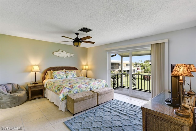 bedroom with access to outside, light tile patterned floors, a textured ceiling, and ceiling fan