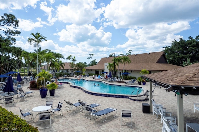 view of swimming pool with a patio