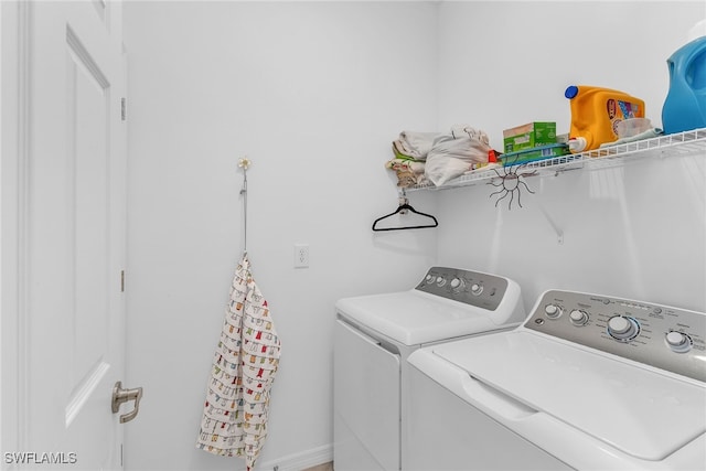 washroom with laundry area and independent washer and dryer