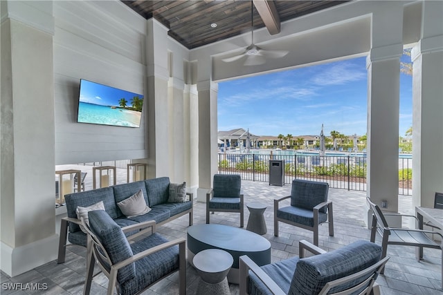 view of patio / terrace with ceiling fan, an outdoor hangout area, and a residential view