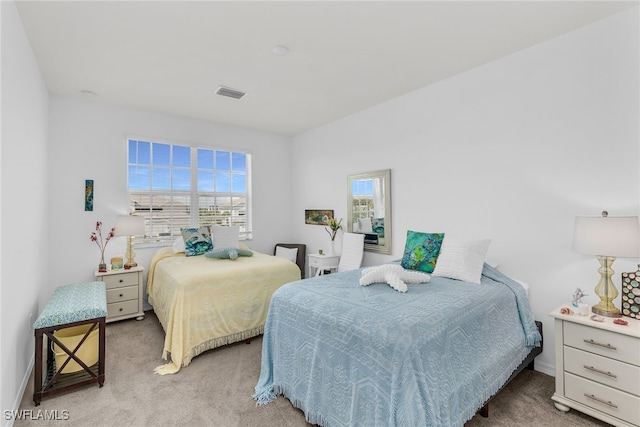 bedroom featuring carpet floors, baseboards, and visible vents