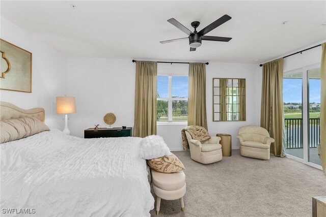 bedroom with baseboards, ceiling fan, carpet, and access to exterior