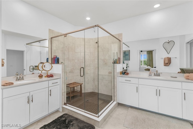 bathroom featuring recessed lighting, a shower stall, a sink, and tile patterned flooring