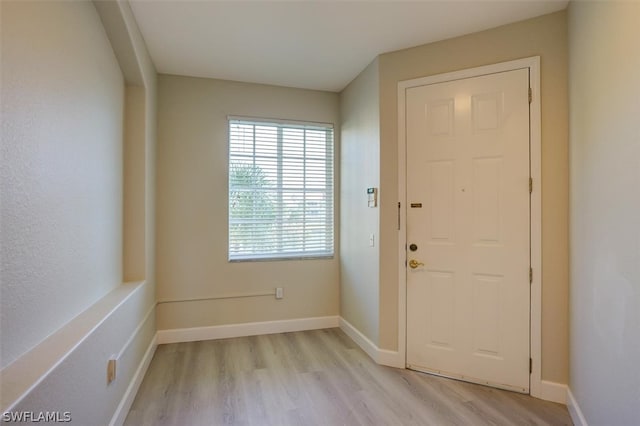 doorway to outside with light hardwood / wood-style floors