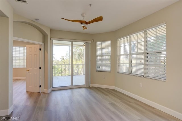 doorway featuring hardwood / wood-style floors and ceiling fan