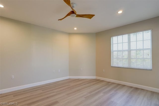 unfurnished room featuring light hardwood / wood-style floors and ceiling fan