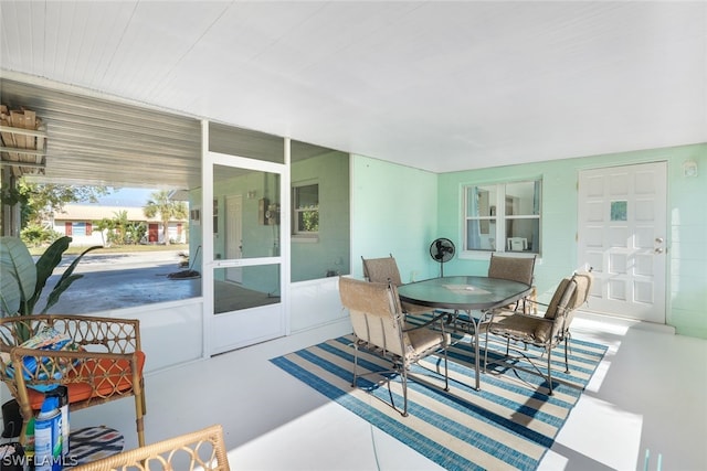 dining space featuring concrete floors