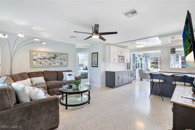 living room with ceiling fan