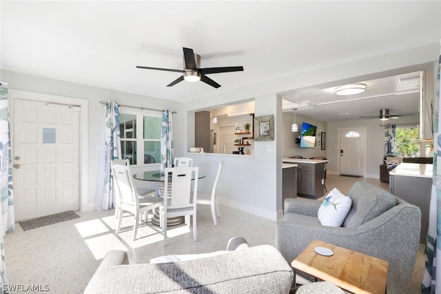 dining area with ceiling fan and a wealth of natural light