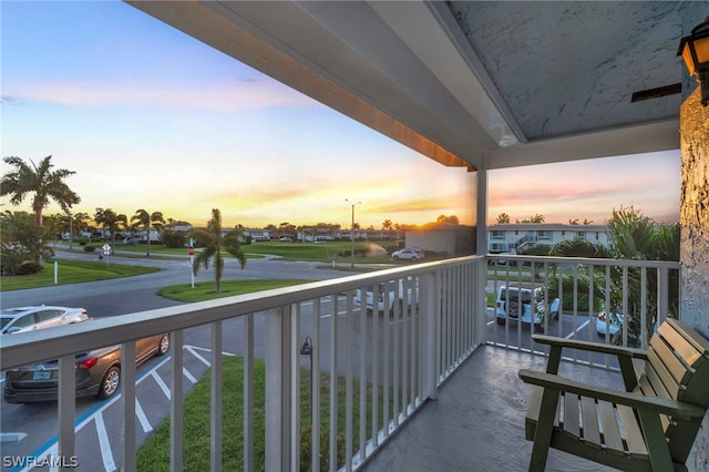 view of balcony at dusk