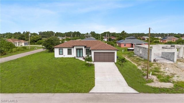 view of front facade with a front lawn and a garage