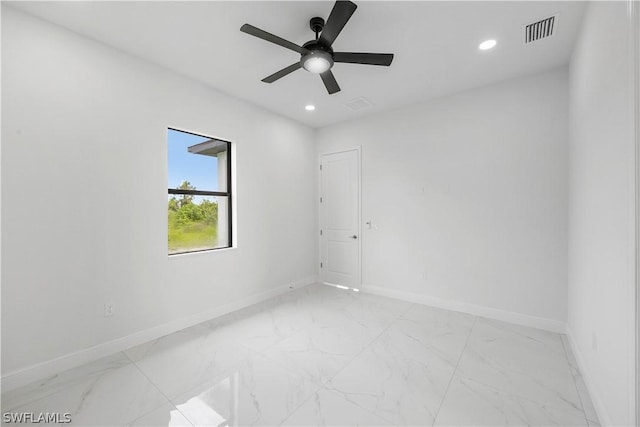 spare room with ceiling fan