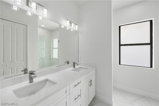 bathroom featuring vanity and an enclosed shower