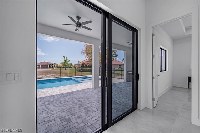 entryway featuring ceiling fan and light tile floors