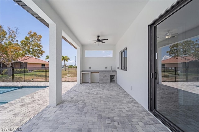 view of terrace featuring a fenced in pool and ceiling fan