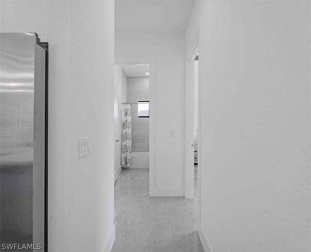 corridor with light tile floors