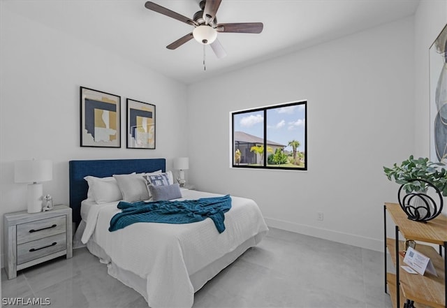 bedroom featuring ceiling fan and light tile floors