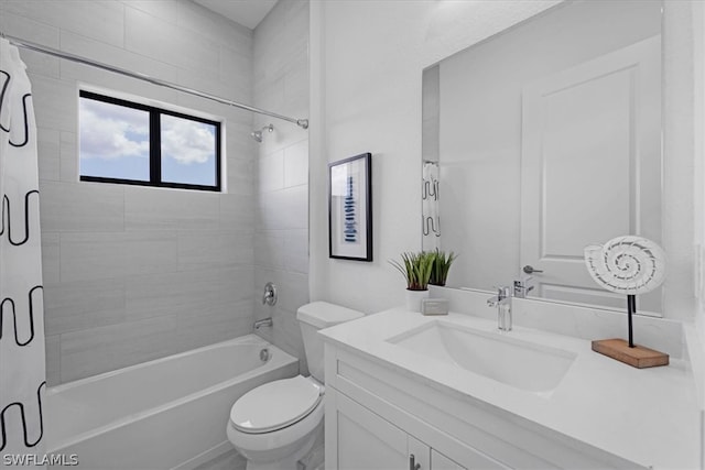 full bathroom featuring tiled shower / bath, toilet, and oversized vanity