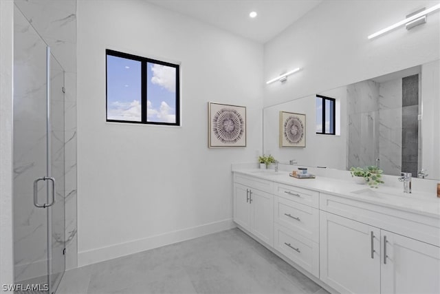 bathroom featuring a shower with door, dual sinks, tile flooring, and large vanity