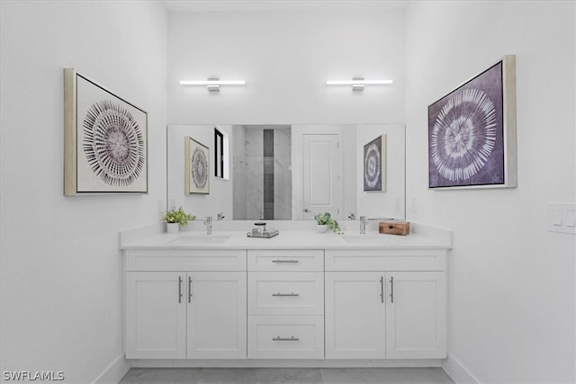 bathroom featuring double sink and large vanity