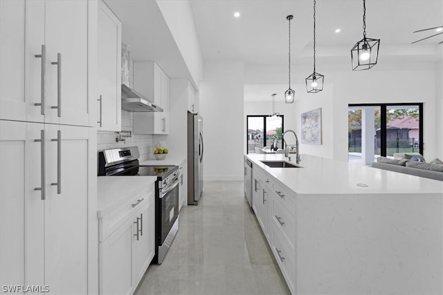 kitchen with sink, stainless steel appliances, and white cabinetry