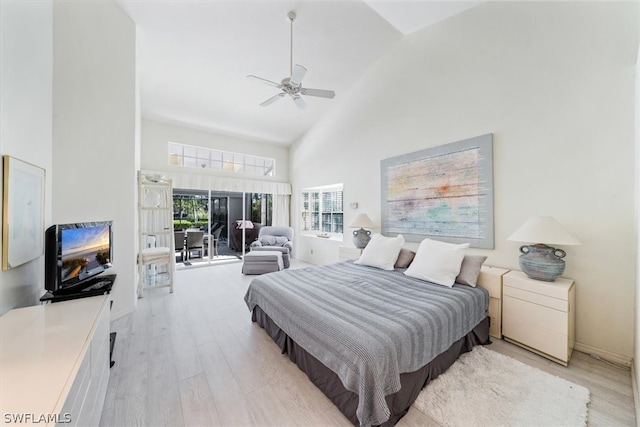 bedroom featuring access to exterior, ceiling fan, high vaulted ceiling, and light wood-type flooring