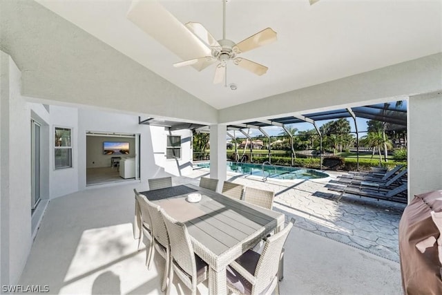 view of patio / terrace with ceiling fan and a lanai